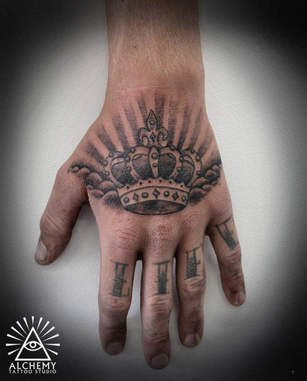tattoo, Crown Tattoo Crown tattoo on hand, also the text life on his fingers.
by: Alchemy tattoo studios