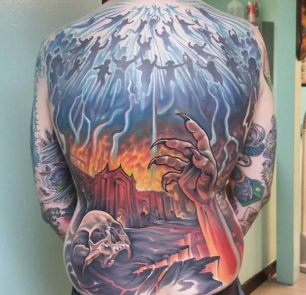 tattoo, Heaven And Hell Huge back piece of heaven and hell, with a zombie like arm coming from hell, and angels floating to heaven
