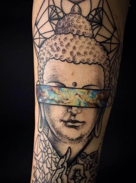 tattoo, Space Buddha Buddha where the eyes are turned into space.