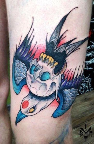tattoo, Bird With A Skull A bird flying away with a skull on top of it.