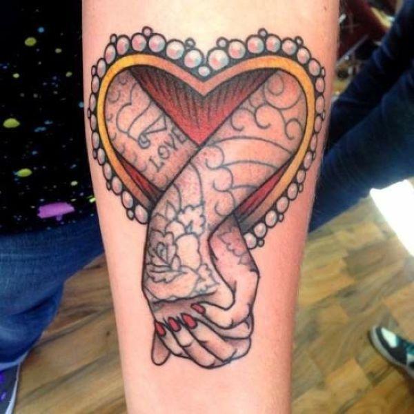 tattoo, Holding Hands Tattooed arms inside a heart that are holding hands, Love <3