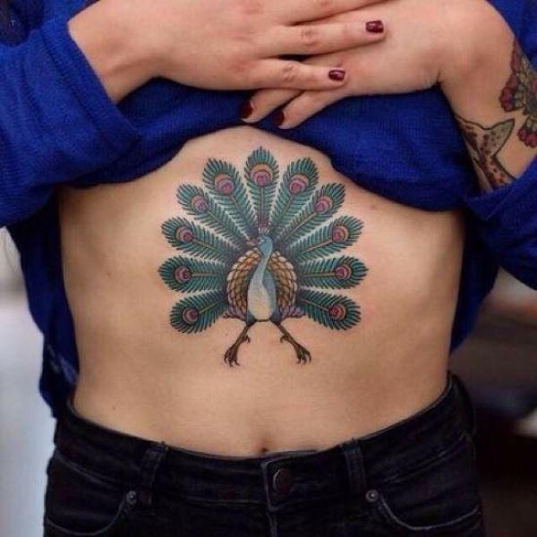 tattoo, Peacock Bold peacock stomach tattoo